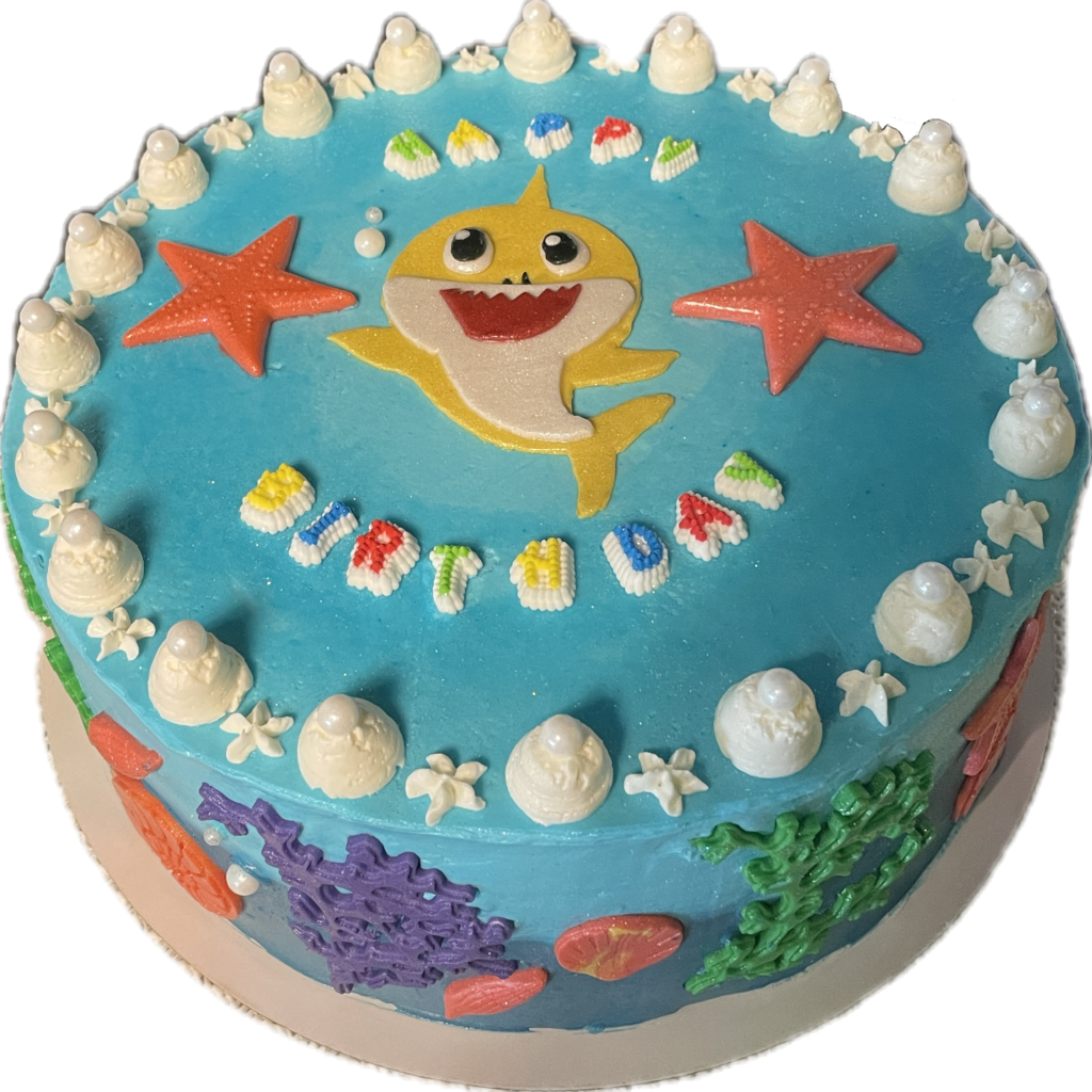 Two tone blue cake decorated with fondant seaweed and baby shark