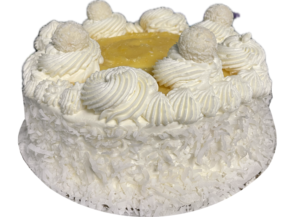 Lemon cake topped with lemon curd.  Frosted and decorated with whipped cream cheese coconut frosting and coconut flakes.